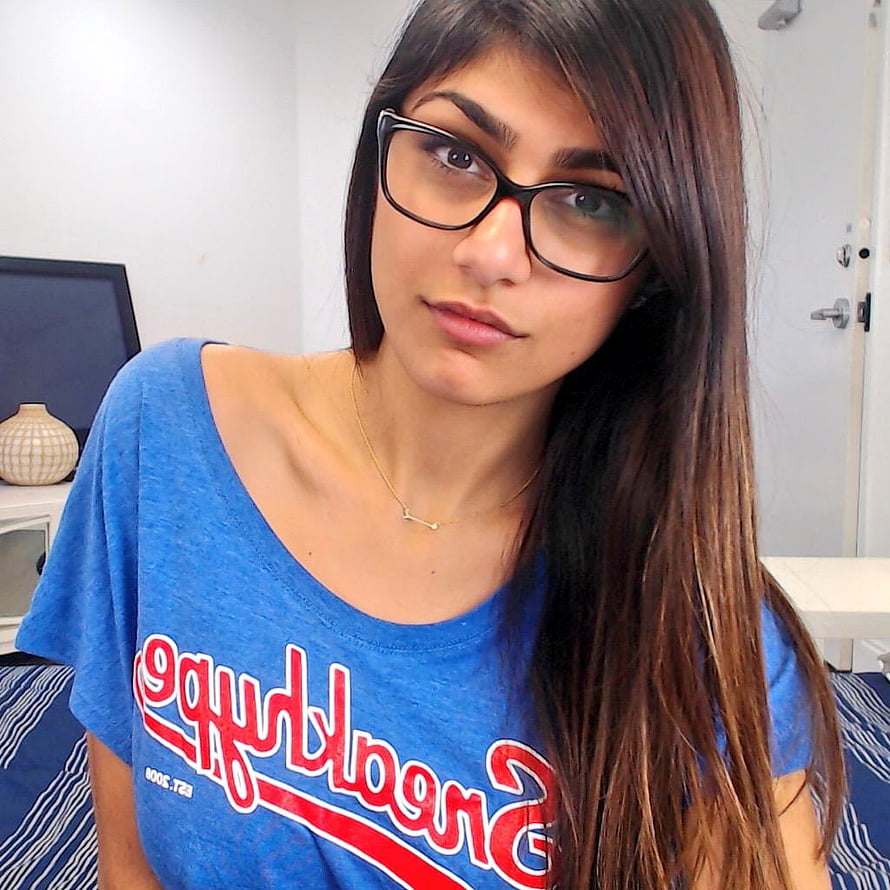 Portrait of a young woman with long dark hair wearing black glasses and a blue t-shirt, Mia Khalifa HD phone wallpaper