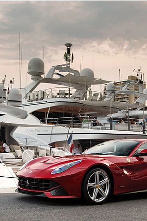 Red Ferrari 812 Superfast Parked at Marina with Luxury Yacht in Background HD phone wallpaper