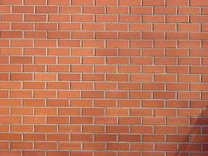 Classic Red Brick Wall Texture With Natural Light And Shadow Details HD wallpaper