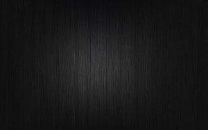 Dark Glossy Black Surface with Subtle Vertical Brushed Texture and Soft Central Highlight HD wallpaper