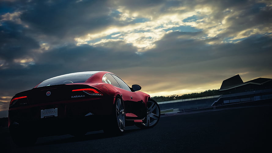Fisker Karma Electric Sports Car Silhouette on a Track at Dusk HD wallpaper