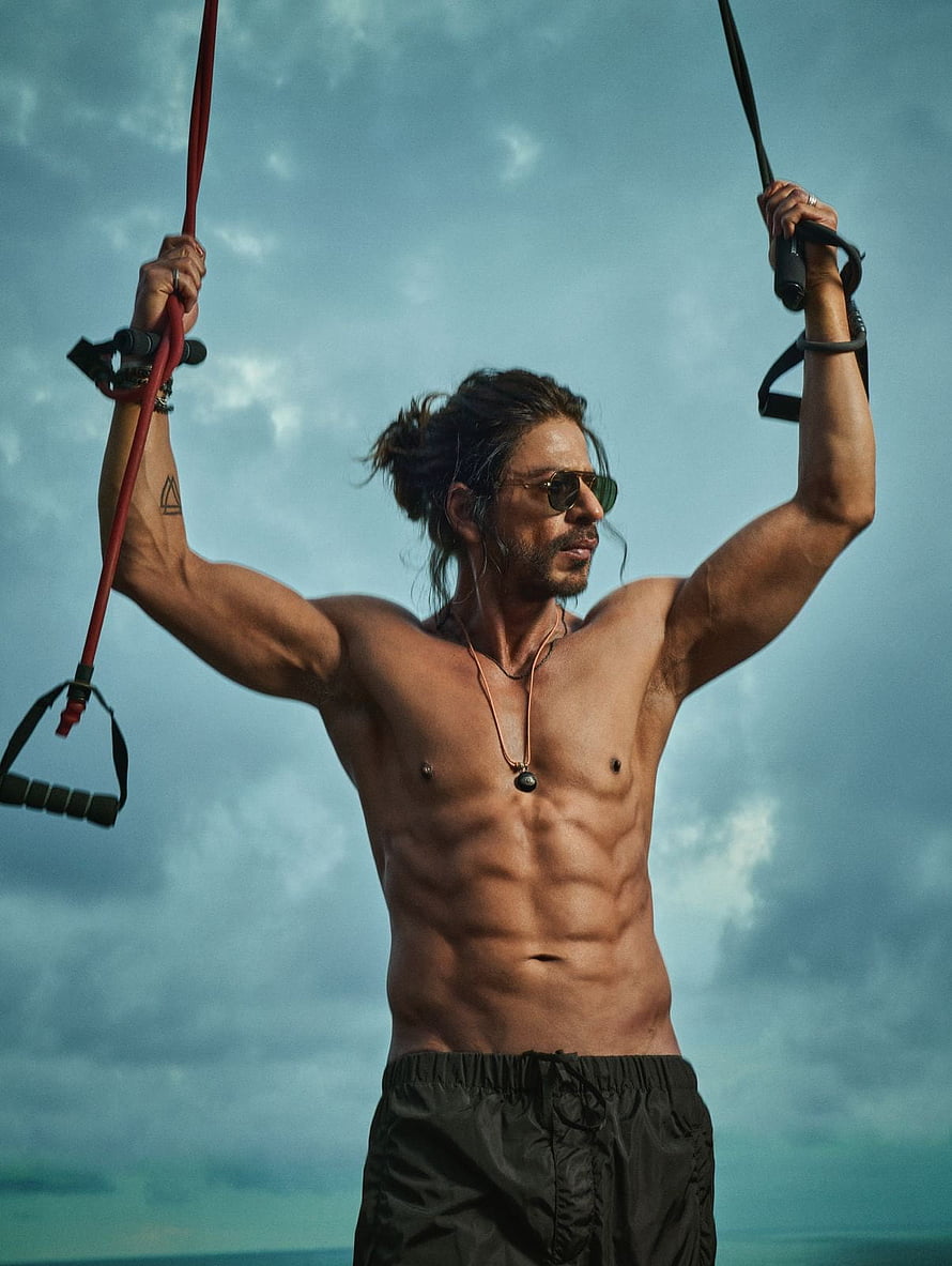 Shah Rukh Khan Shirtless Workout With Resistance Bands Against Cloudy Sky HD phone wallpaper