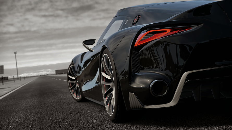 Sleek Black Supercar Rear View on Open Road with Dramatic Lighting HD wallpaper