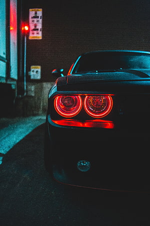 Dodge Challenger Rear View with Glowing Red Taillights at Night HD phone wallpaper