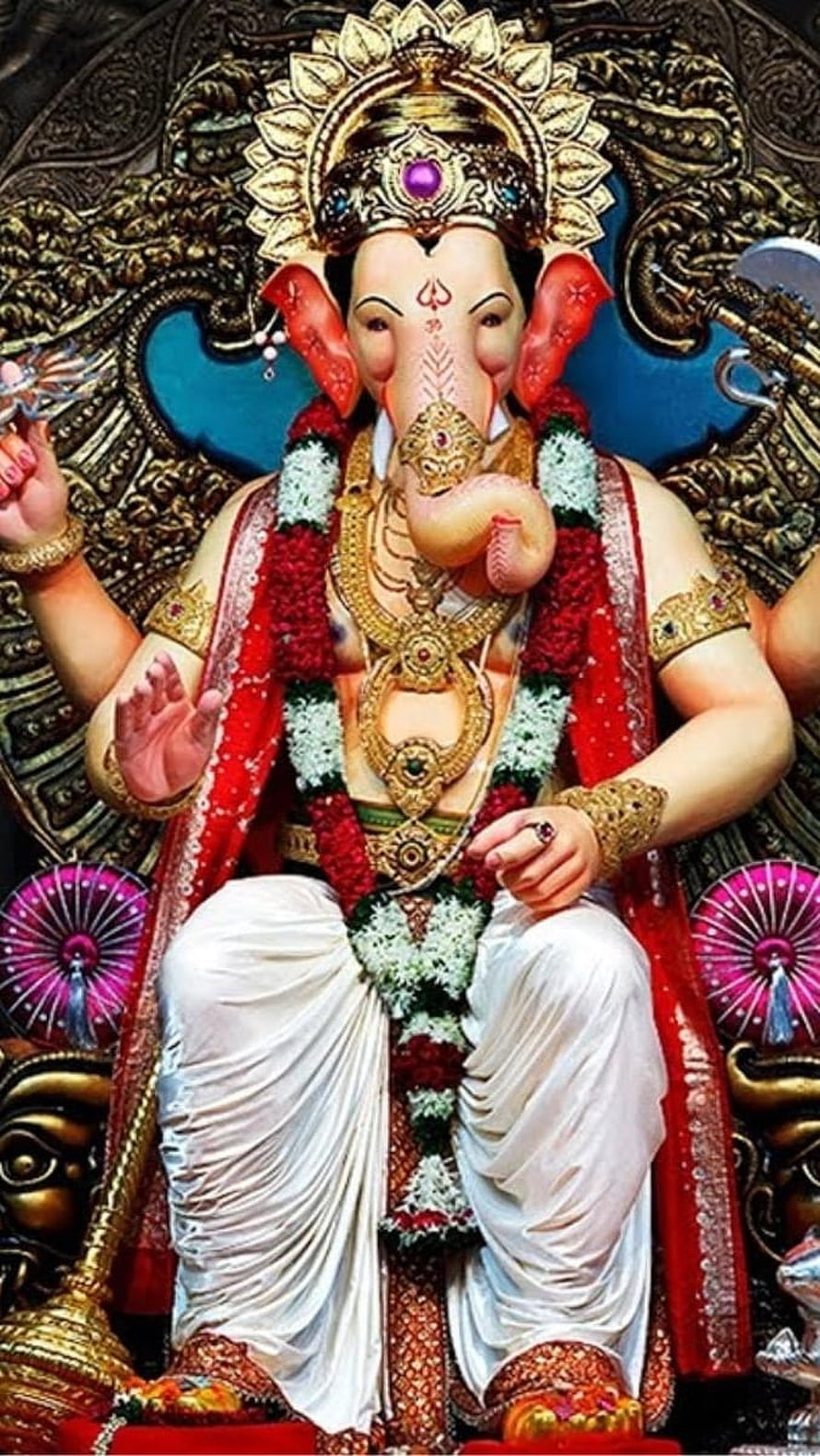 Lord Ganesha Seated Statue Adorned With Floral Garlands And Gold Jewelry HD phone wallpaper