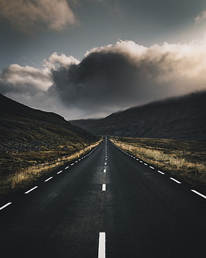 Moody Mountain Road Stretching Into Dramatic Storm Clouds HD phone wallpaper