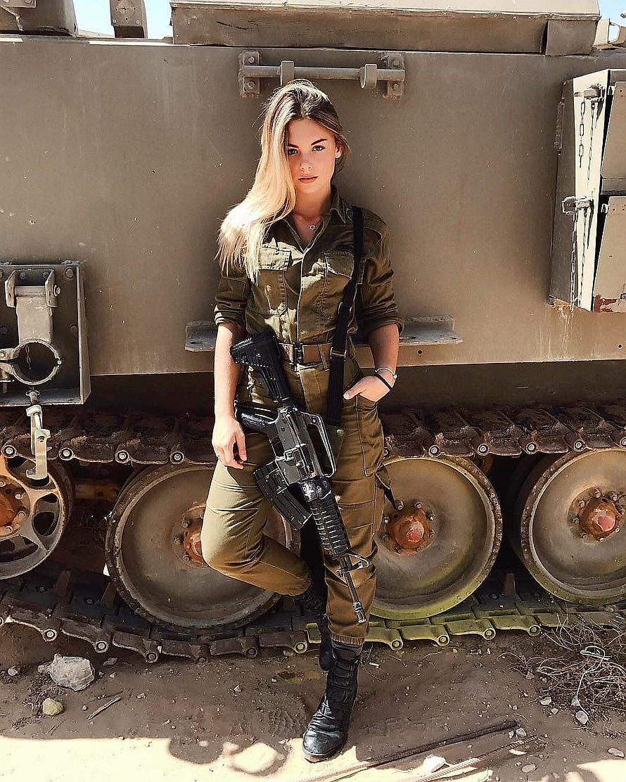 Female Soldier in Olive Fatigue Uniform Holding Rifle in Front of Armored Tank HD phone wallpaper