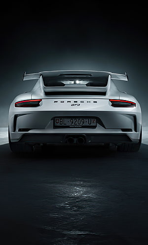 Porsche 911 GT3 RS Rear View with Fixed Wing and Dual Exhausts in Dark Studio Setting HD phone wallpaper