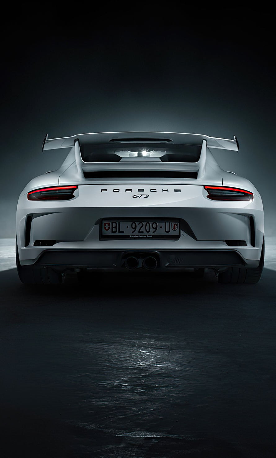 Porsche 911 GT3 RS Rear View with Fixed Wing and Dual Exhausts in Dark Studio Setting HD phone wallpaper
