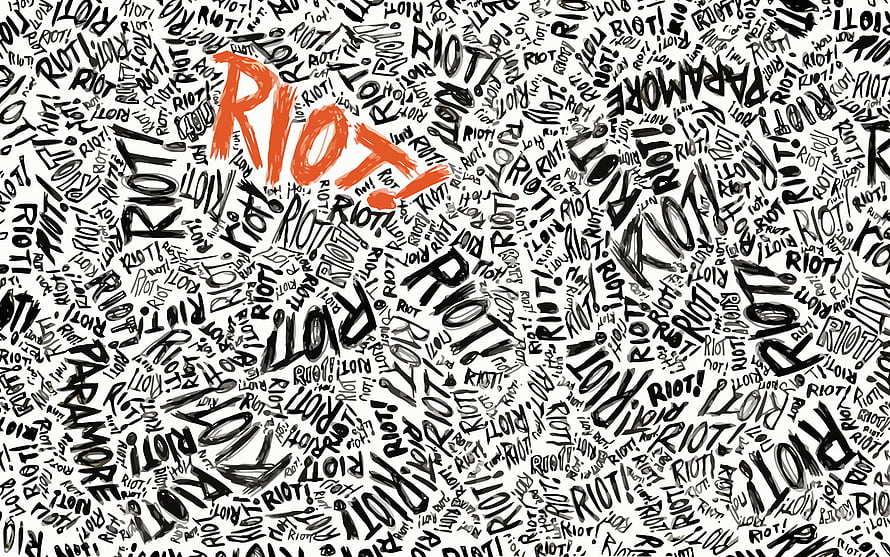 Paramore Riot Album Artwork with Bold Orange Typography and Black Handwritten Text Pattern HD wallpaper