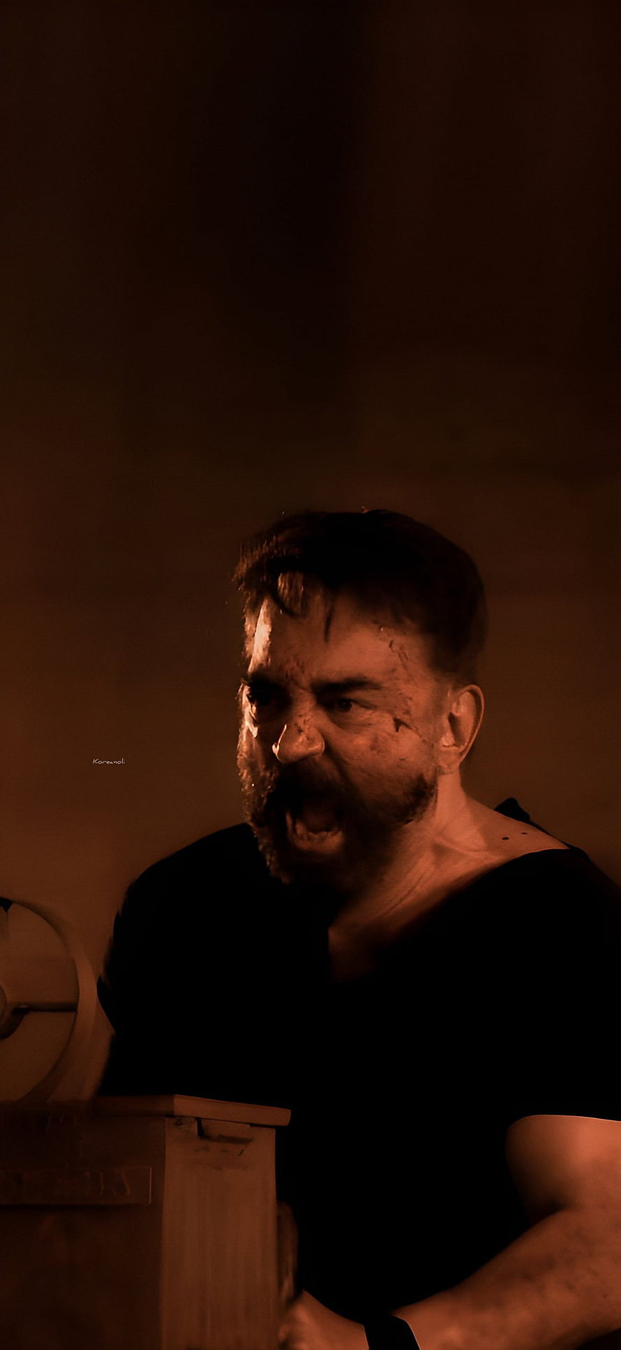 Kamal Haasan as Vikram in Intense Action Scene with Dramatic Warm Lighting HD phone wallpaper