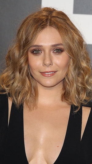 Elizabeth Olsen Portrait in Black Gown with Wavy Blonde Hair HD phone wallpaper