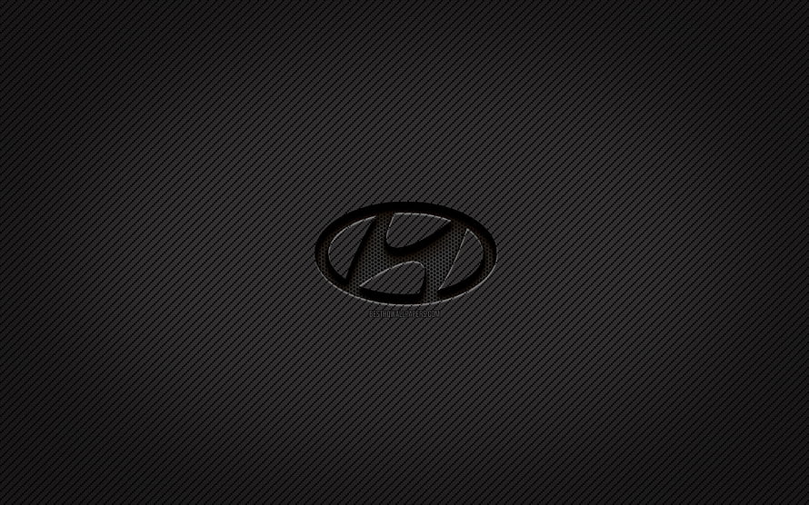 Hyundai emblem on dark carbon fiber texture with subtle diagonal weave pattern HD wallpaper