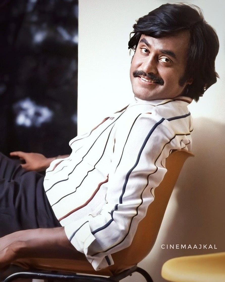 Rajinikanth in a white striped shirt seated in a chair with a warm smile HD phone wallpaper