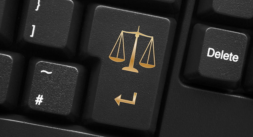 Close-up of a keyboard key featuring a golden scales of justice symbol HD wallpaper