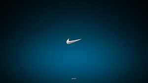 Nike Swoosh Logo on Dark Blue Gradient Background with Just Do It Tagline HD wallpaper