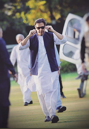 Imran Khan Walking Outdoors in Traditional White Shalwar Kameez and Blue Waistcoat HD phone wallpaper