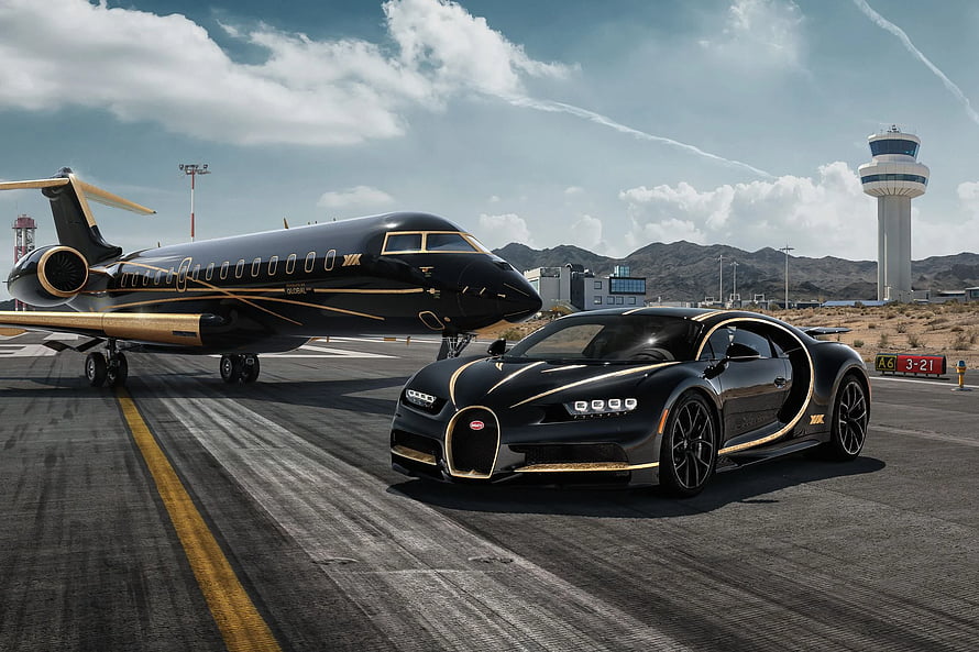 Black and Gold Bugatti Chiron Parked on Tarmac Next to Private Jet at Airport HD wallpaper