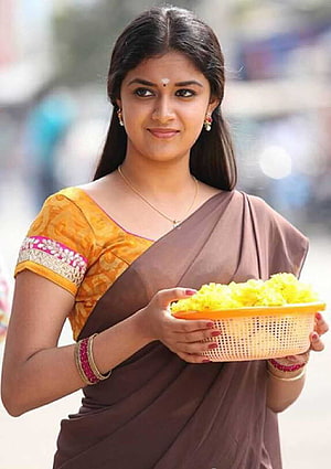 Keerthi Suresh in Brown Saree Holding Basket of Yellow Flowers HD phone wallpaper