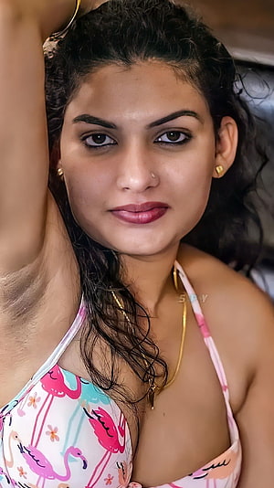Portrait of a woman in a flamingo print bikini top with wet hair and gold jewelry, Reshmi nair, malayalam movie HD phone wallpaper