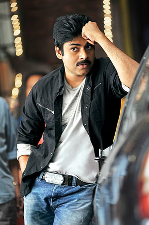 Pawan Kalyan in Black Jacket and Jeans with Festive Bokeh Lights HD phone wallpaper