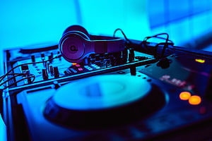 DJ Turntable and Headphones Setup Under Blue Neon Lighting HD wallpaper
