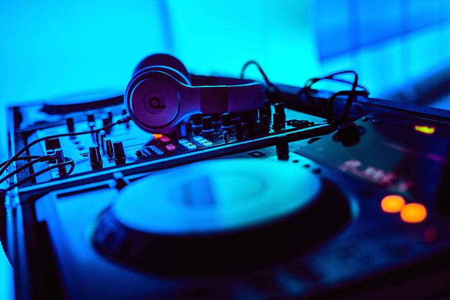 DJ Turntable and Headphones Setup Under Blue Neon Lighting HD wallpaper