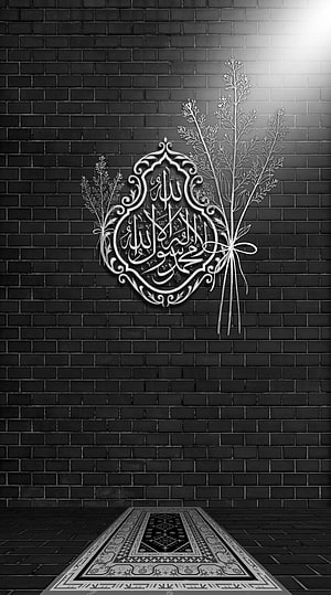 Islamic Calligraphy Art on Dark Brick Wall with Prayer Rug HD phone wallpaper
