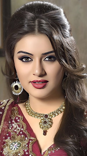 Portrait of a woman in traditional maroon attire with intricate gold embroidery and heavy jewelry, Hansika Motwani, bollywood actress HD phone wallpaper