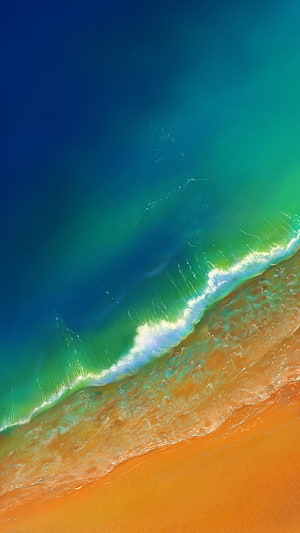 Aerial View of Turquoise Ocean Waves Rolling onto a Golden Sandy Beach HD phone wallpaper