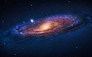 Tilted Spiral Galaxy with Luminous Core and Dust Lanes in Deep Space HD wallpaper