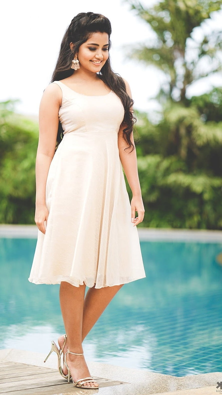 Woman in Elegant Cream Dress Standing by Poolside with Gold Heels, Anupama Parameswaran, Anupama, Heroine HD phone wallpaper