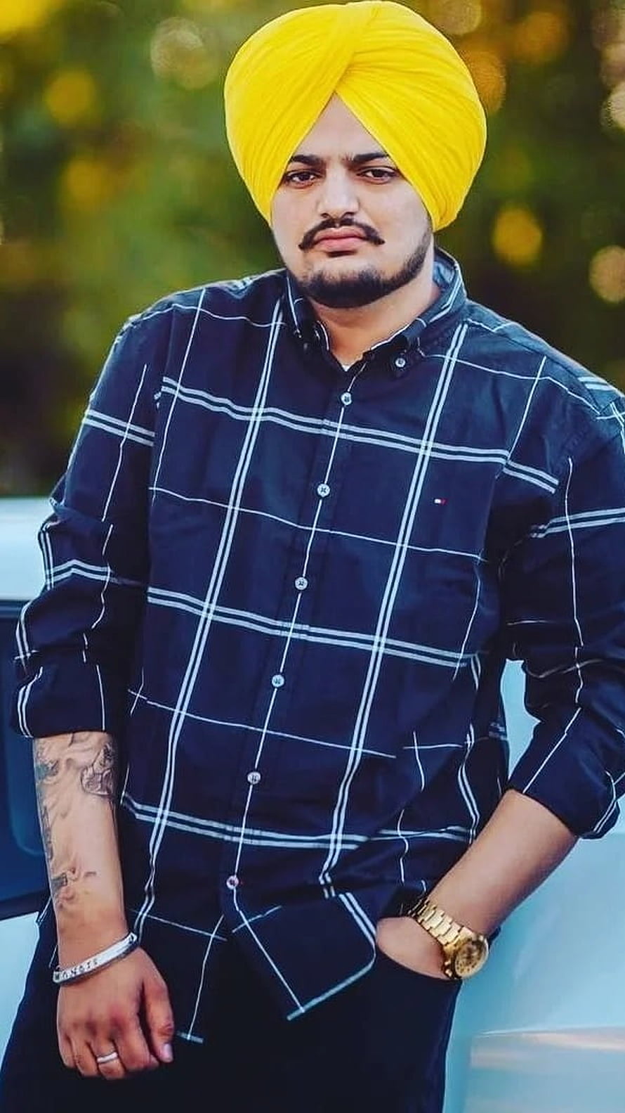 Sidhu Moose Wala Portrait Wearing Yellow Turban and Plaid Shirt HD phone wallpaper