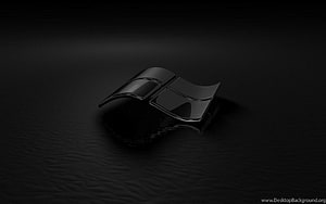 Sleek Black Windows Logo Emblem on Dark Textured Surface HD wallpaper