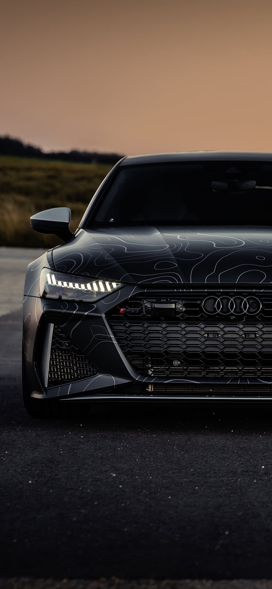 Black Audi RS7 Sportback with Topographic Wrap on Road at Sunset HD phone wallpaper