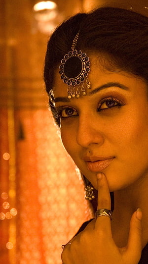 Nayantara Portrait in Traditional Indian Jewelry with Maang Tikka and Warm Golden Lighting HD phone wallpaper