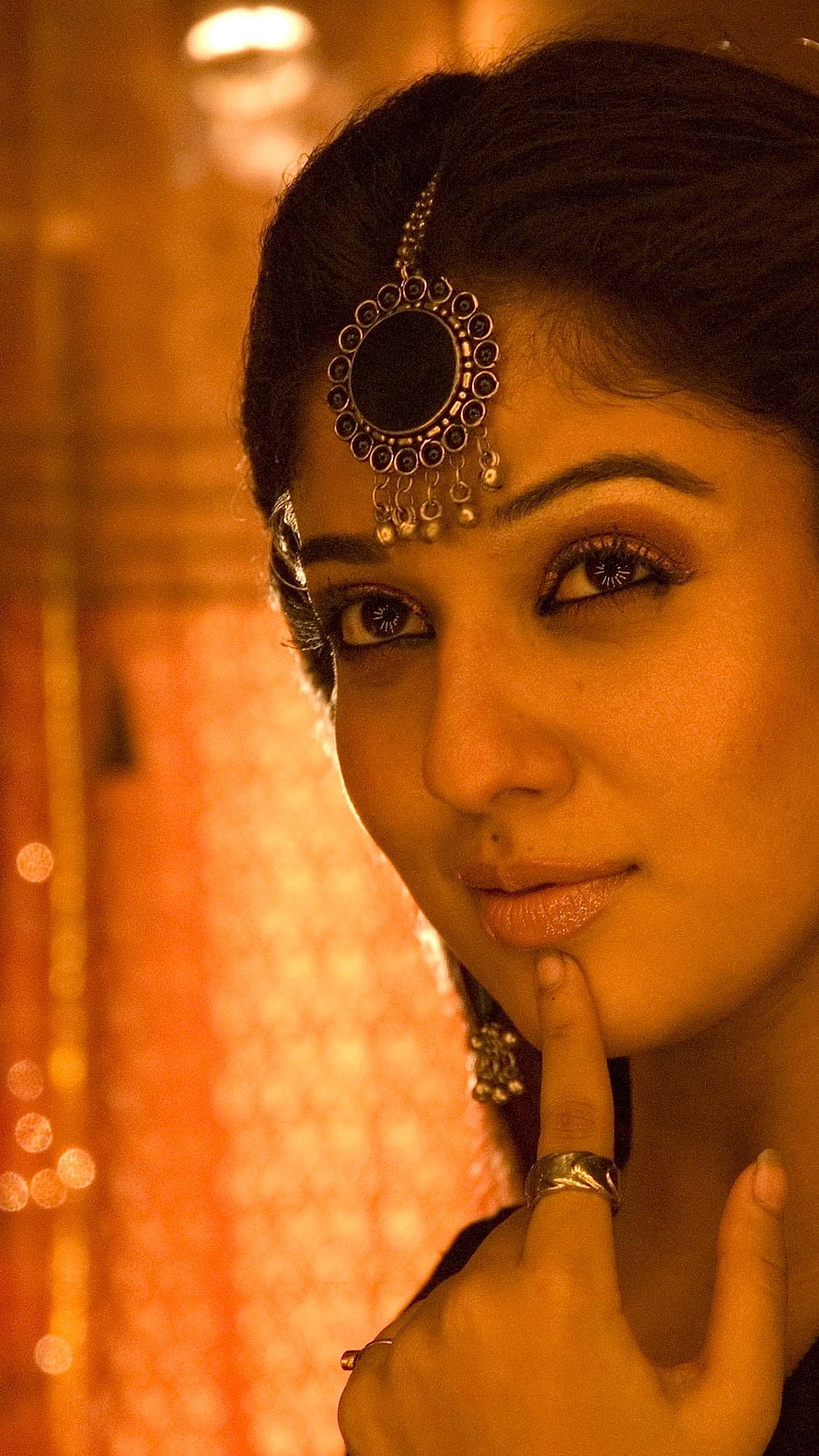 Nayantara Portrait in Traditional Indian Jewelry with Maang Tikka and Warm Golden Lighting HD phone wallpaper