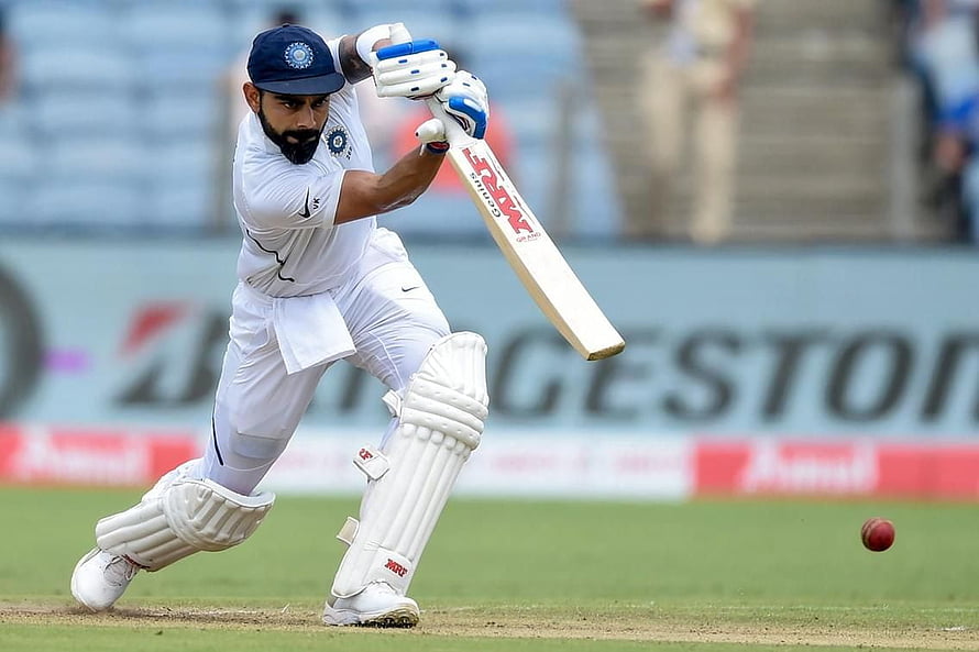 Virat Kohli Playing Cover Drive in Indian Test Cricket Whites HD wallpaper