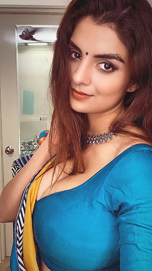 Portrait of a woman wearing a blue blouse and silver choker necklace, Anveshi jain, bollywood actress, cleavage HD phone wallpaper