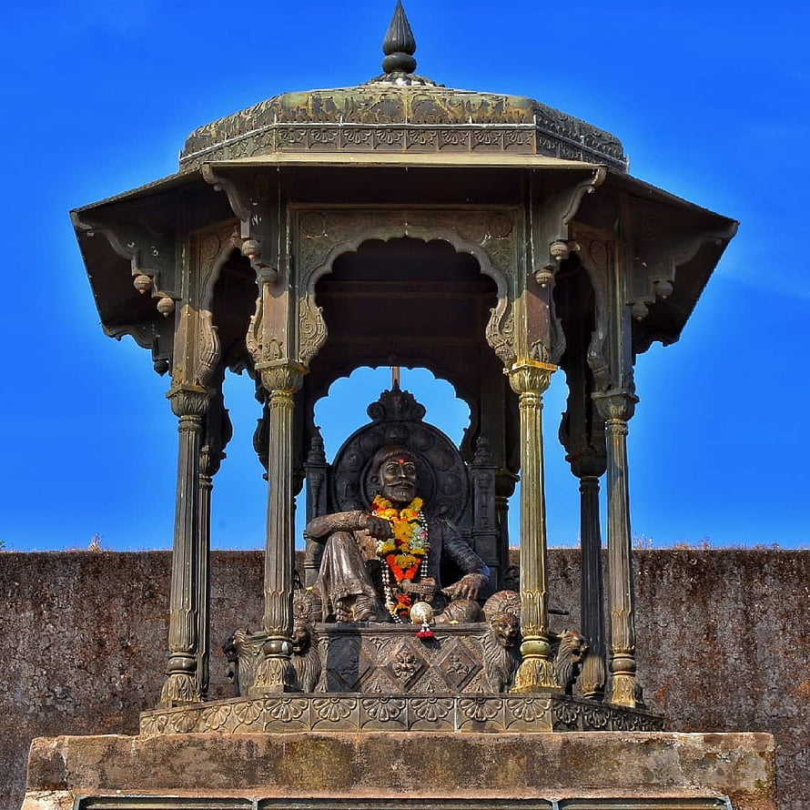 Ornate Bronze Temple Pavilion With Seated Deity Statue Under Blue Sky HD phone wallpaper