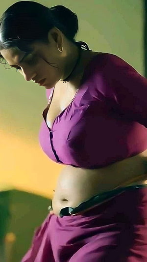 Swasika Vijay in a purple crop top and skirt with a warm yellow background HD phone wallpaper