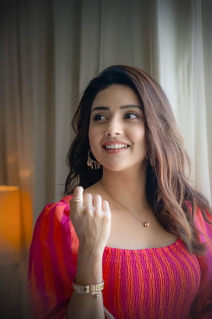 Mahima Nambiar in a vibrant pink and orange striped top with gold jewelry HD phone wallpaper
