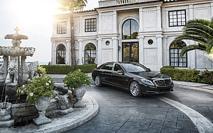 Black Mercedes-Benz S-Class Sedan Parked in Front of a Grand White Mansion with Ornate Fountain HD wallpaper