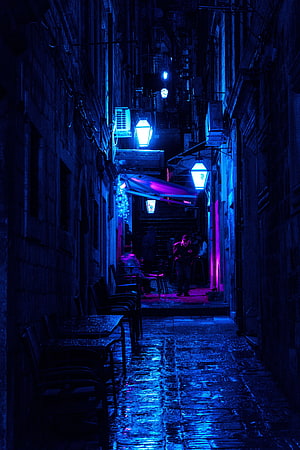 Moody Nighttime Alleyway With Neon Lights And Wet Cobblestones HD phone wallpaper