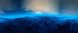 Misty Mountain Range at Sunrise with a Glowing Blue Horizon and Soft Clouds HD wallpaper