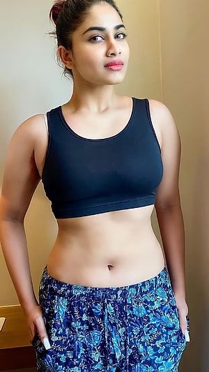 Shivani Narayanan in Black Sports Bra and Blue Floral Pants HD phone wallpaper