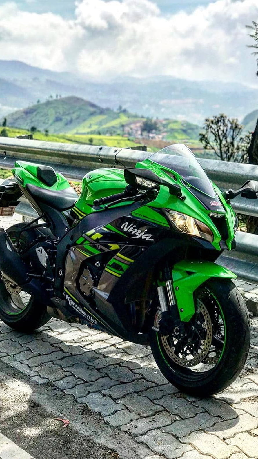 Kawasaki Ninja Green Sports Motorcycle Parked on Mountain Road HD phone wallpaper