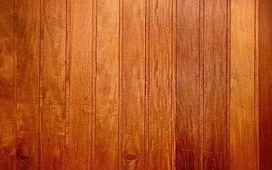 Warm Vertical Wood Plank Texture with Natural Grain Patterns and Rich Amber Tones HD wallpaper
