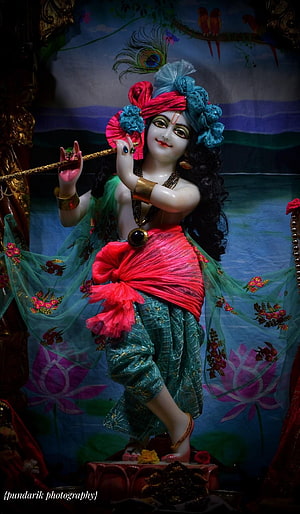 Young Krishna Playing Flute with Peacock Feather Crown and Colorful Attire HD phone wallpaper