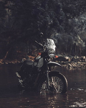 Royal Enfield Himalayan Adventure Motorcycle Parked in Shallow Stream HD phone wallpaper